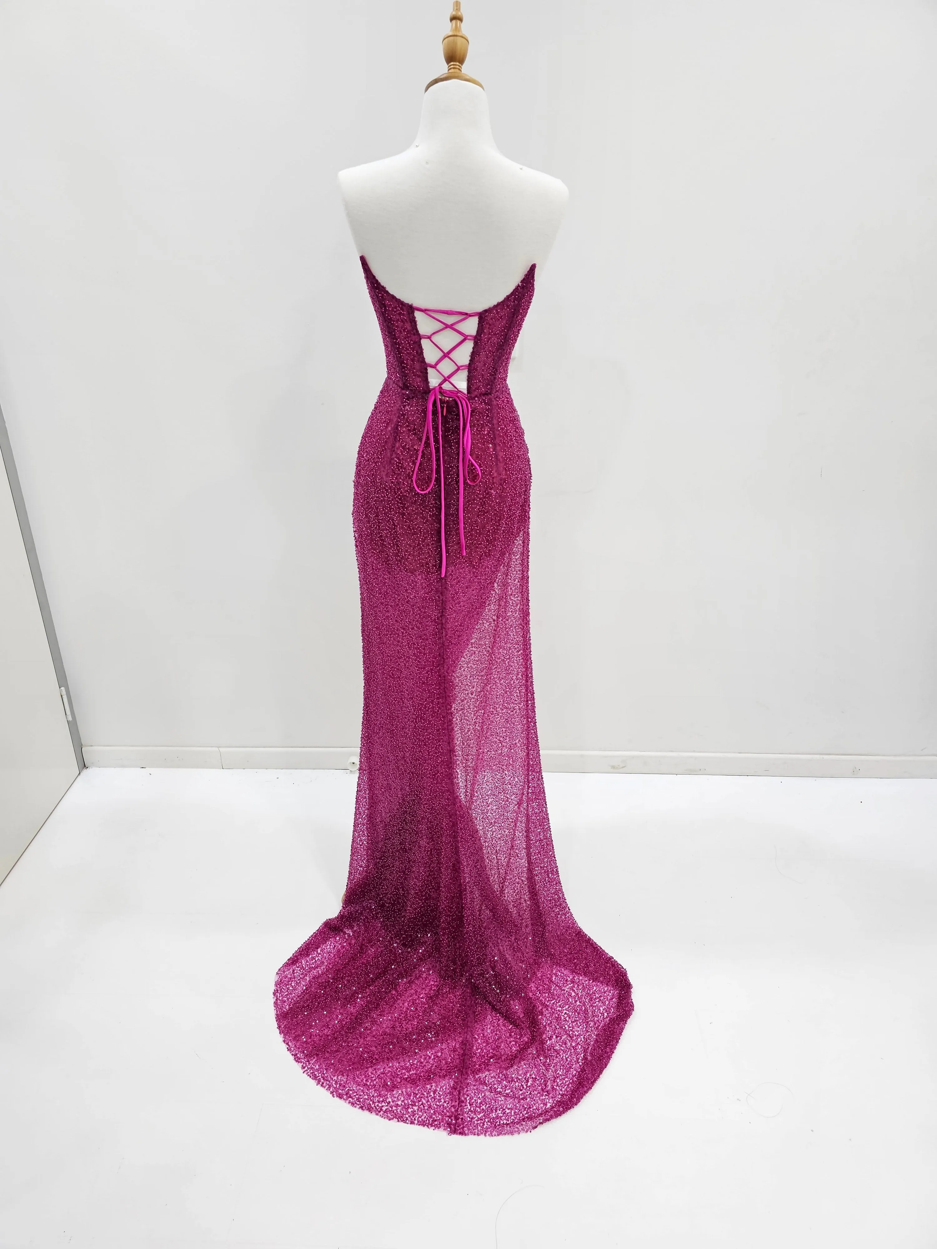 Beaded magenta strapless corset dress for hire